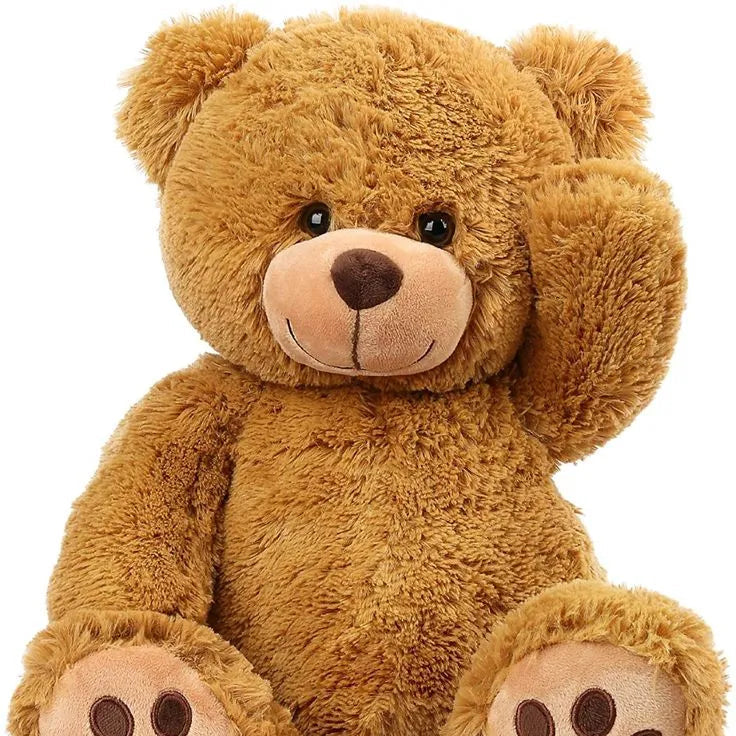 Brown teddy bear with paw prints on paws and feet on a white background