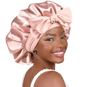 Woman wearing a pink satin bonnet on a white background
