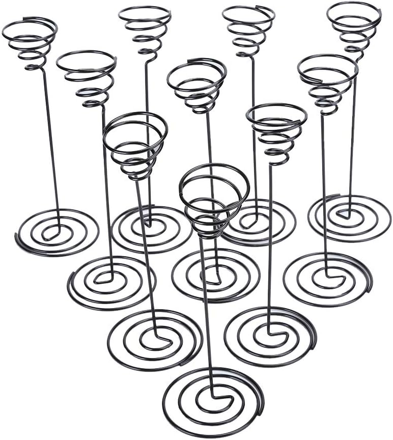 Black wire spiral candle holders on a white background
