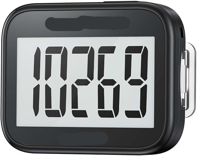 Black pedometer with digital display showing steps, brand 'Neskla' visible