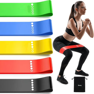 Resistance bands in various colors with a woman exercising using a red band.