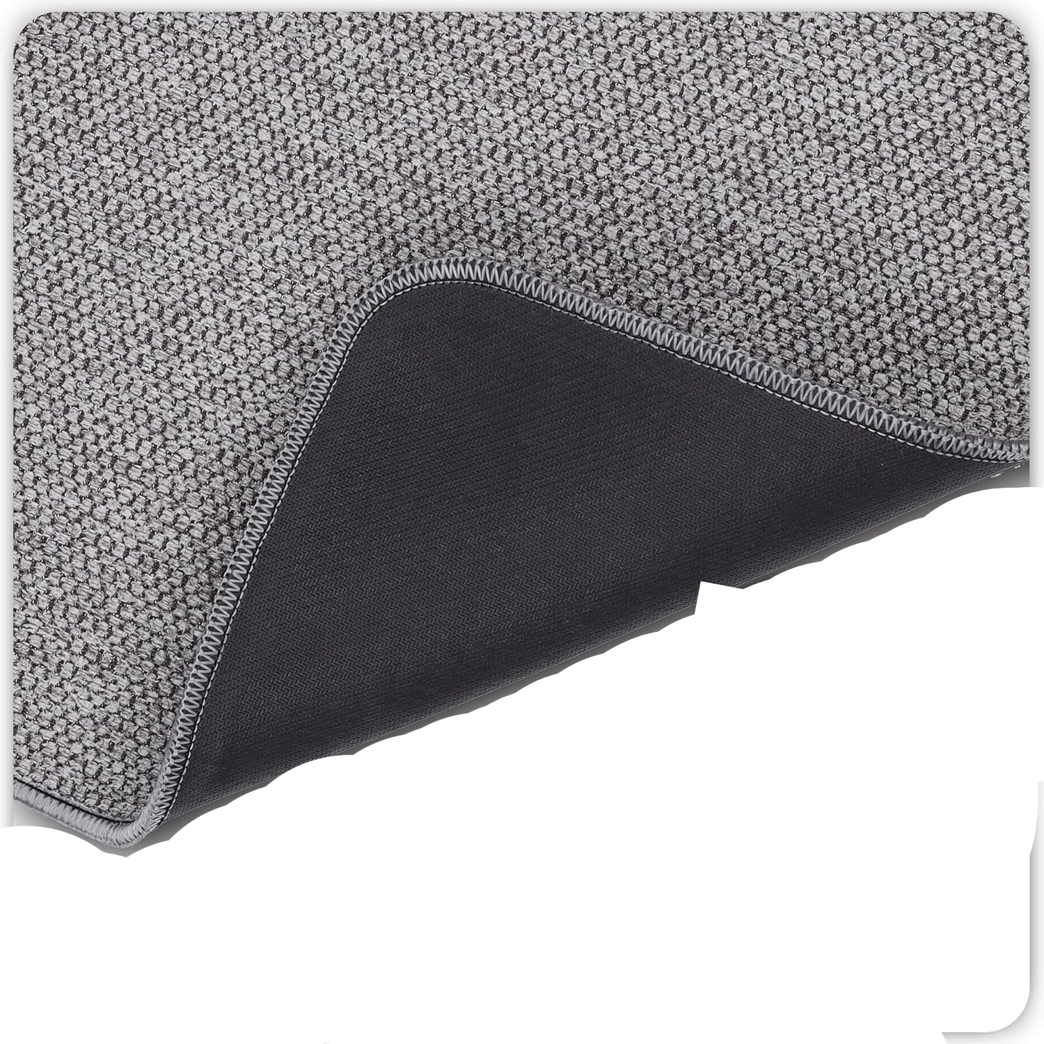 Gray textured mouse pad with a close-up of the rubber backing on a white background