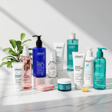 Collection of Crinice skincare products on a marble surface with a plant in the background.
