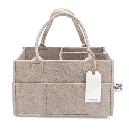 Beige fabric caddy with handles and a visible brand tag on a white background