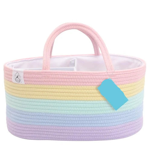 Pastel-colored woven basket with a handle and 'Organi Haus' tag on a white background